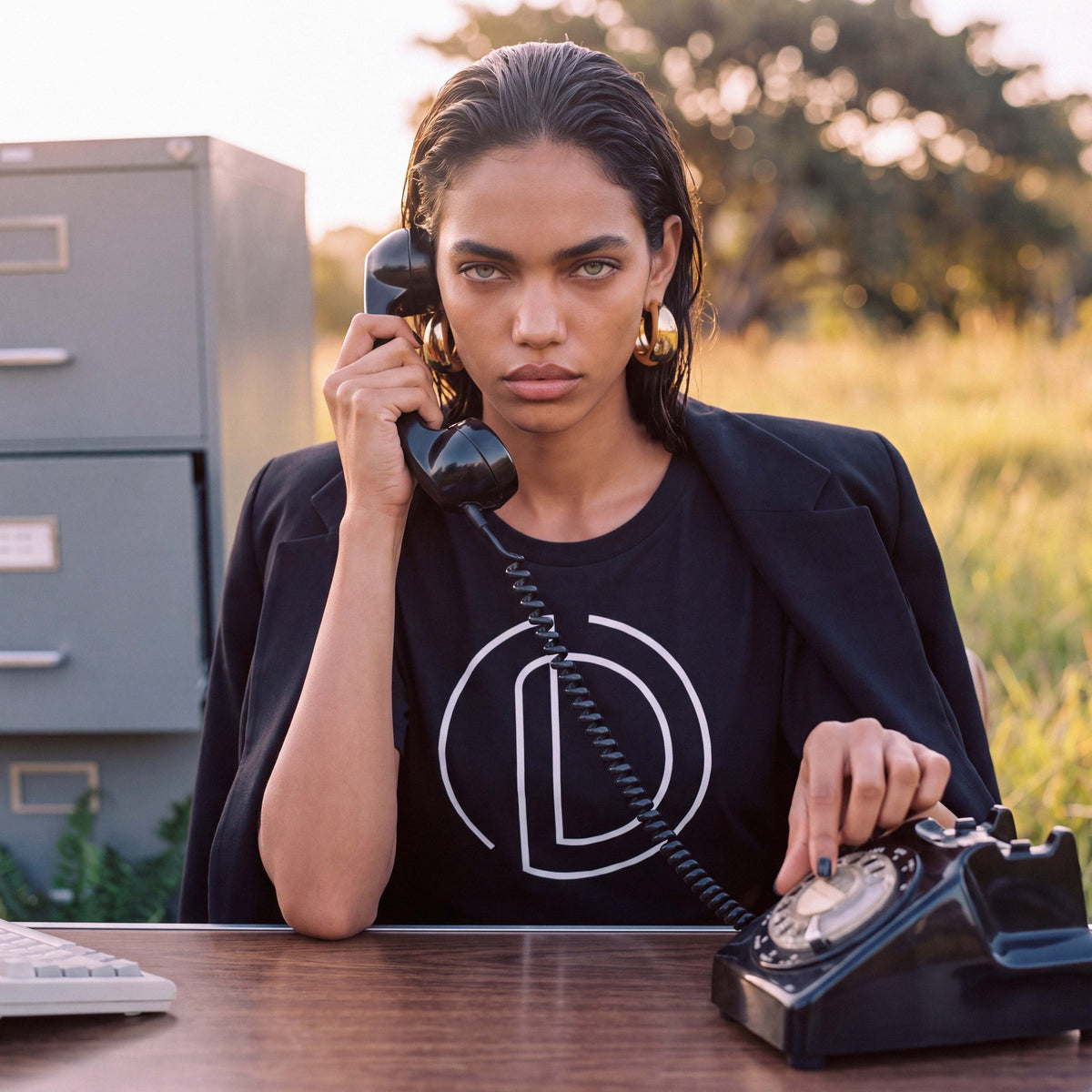Full-length shot of a model in the black AMAYA organic cotton tee – Oldest Daughter, Byron Bay