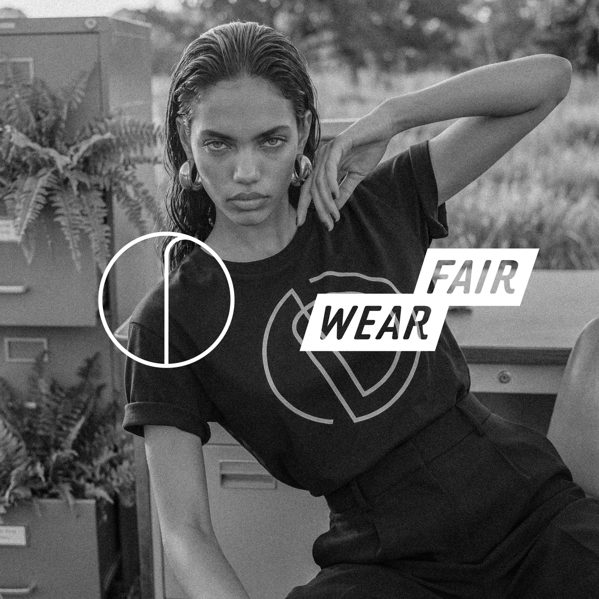 The AMAYA tee in black GOTS-certified organic cotton, sleeve roll detail – Oldest Daughter, Byron Bay