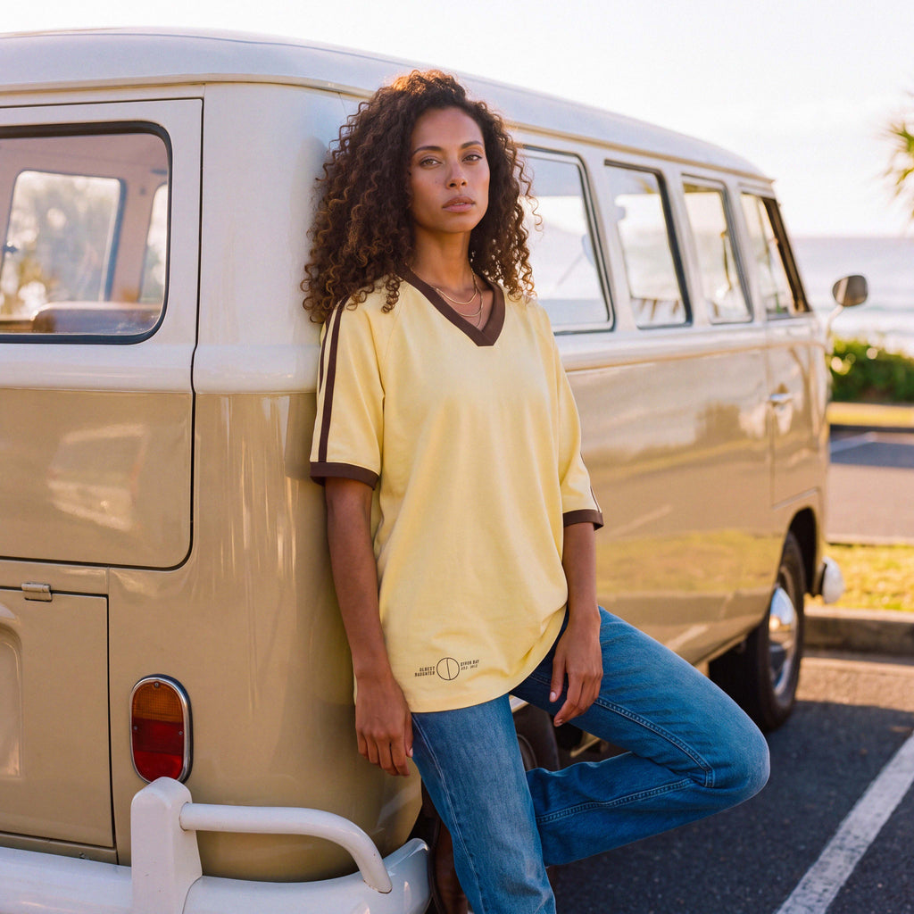 Brown contrast V-neck trim on the pale yellow ANNI organic cotton tee – Oldest Daughter