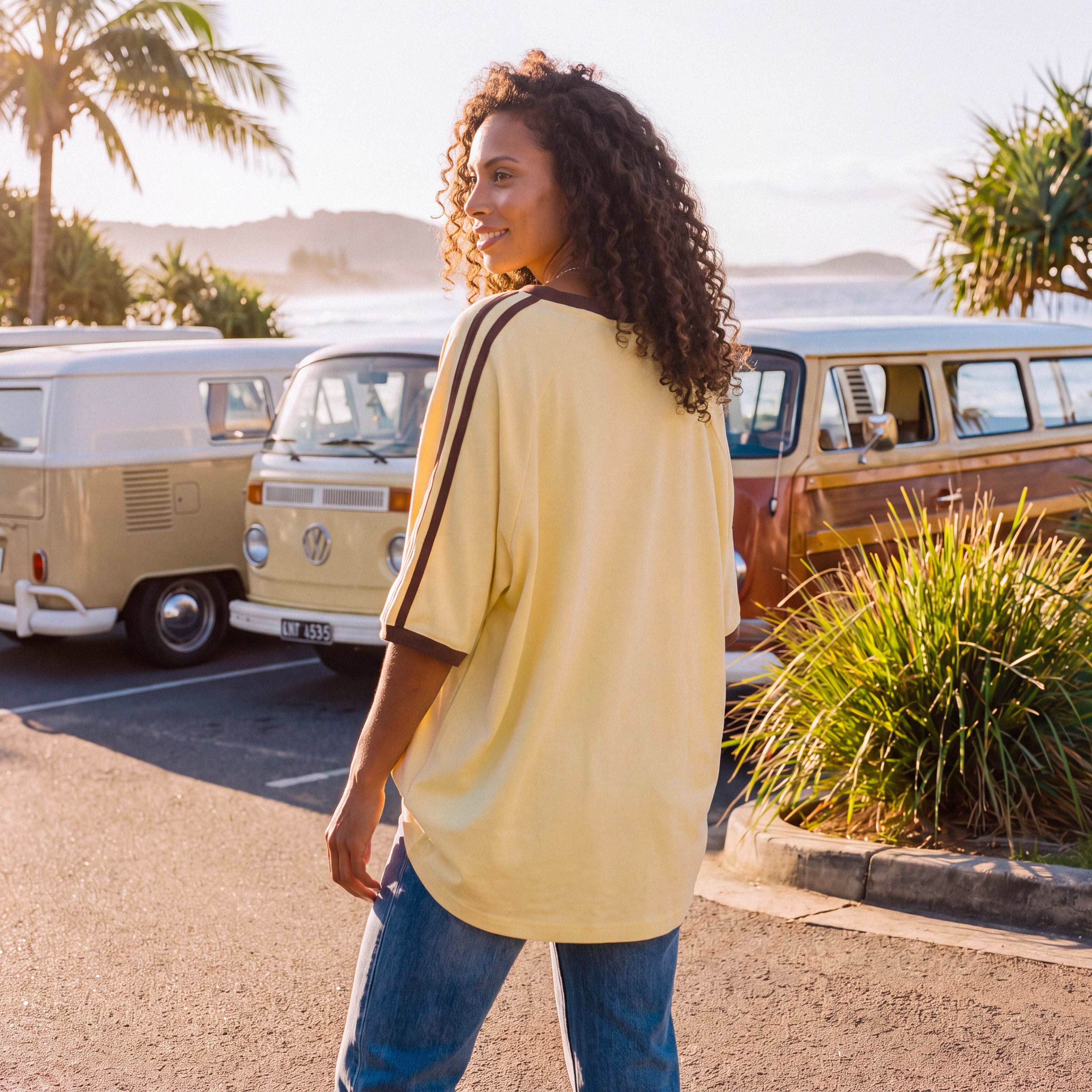 Close-up of the soft organic cotton jersey of the pale yellow ANNI tee – Oldest Daughter