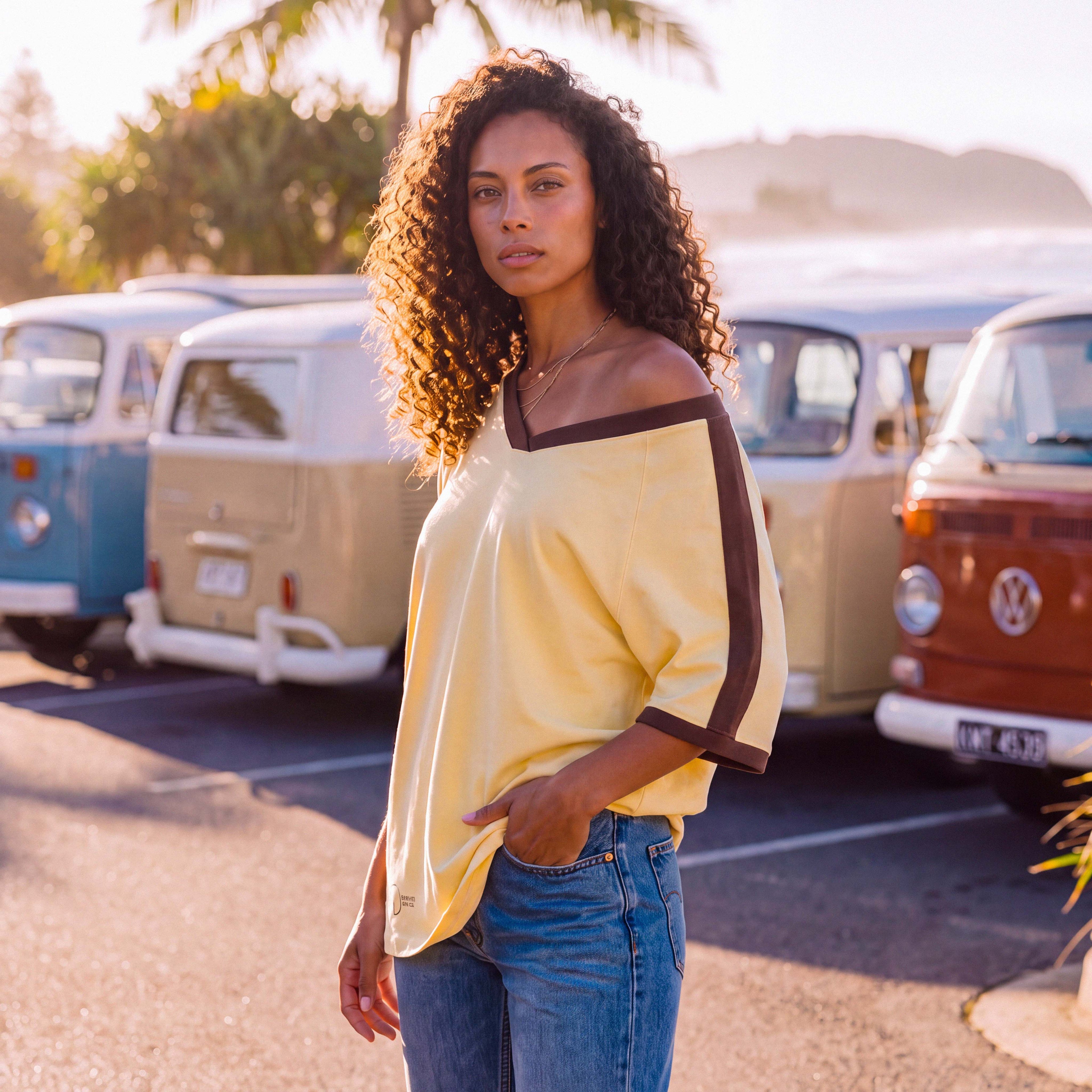 Side view of the extra-oversized ANNI organic cotton tee in pale yellow – Oldest Daughter