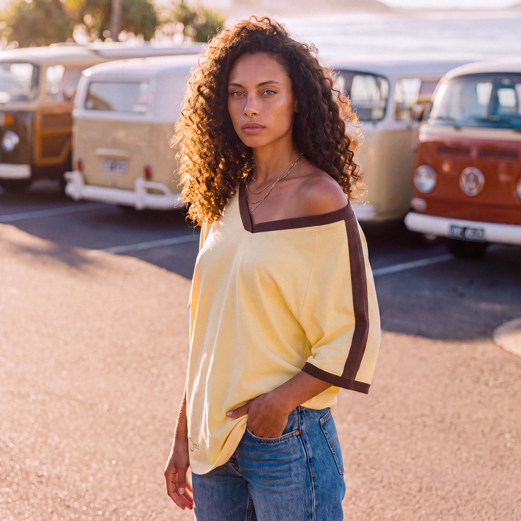Shoulder and neckline of the ANNI organic cotton V-neck tee in pale yellow – Oldest Daughter