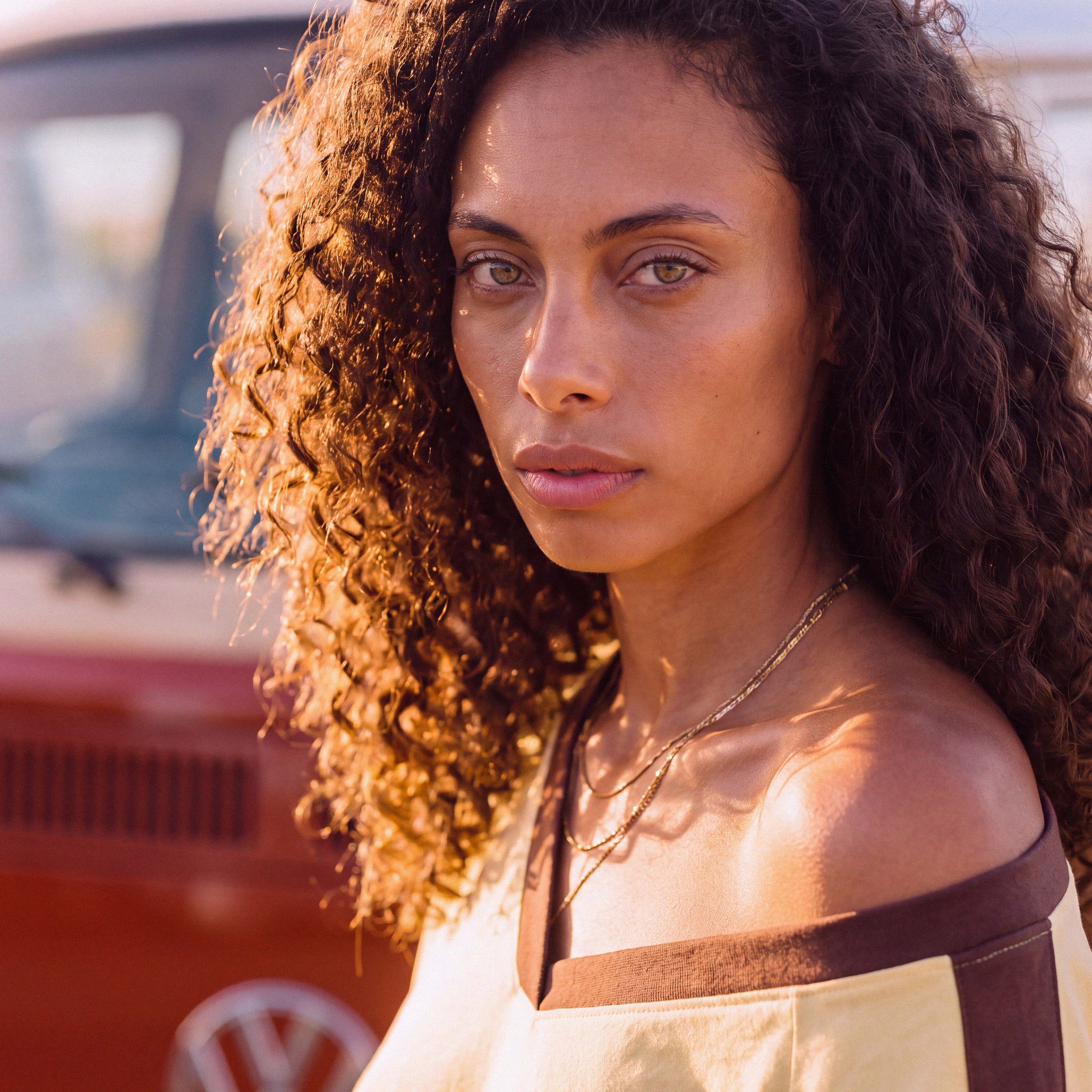 Sleeve detail of the ANNI organic cotton V-neck boyfriend tee in pale yellow – Oldest Daughter