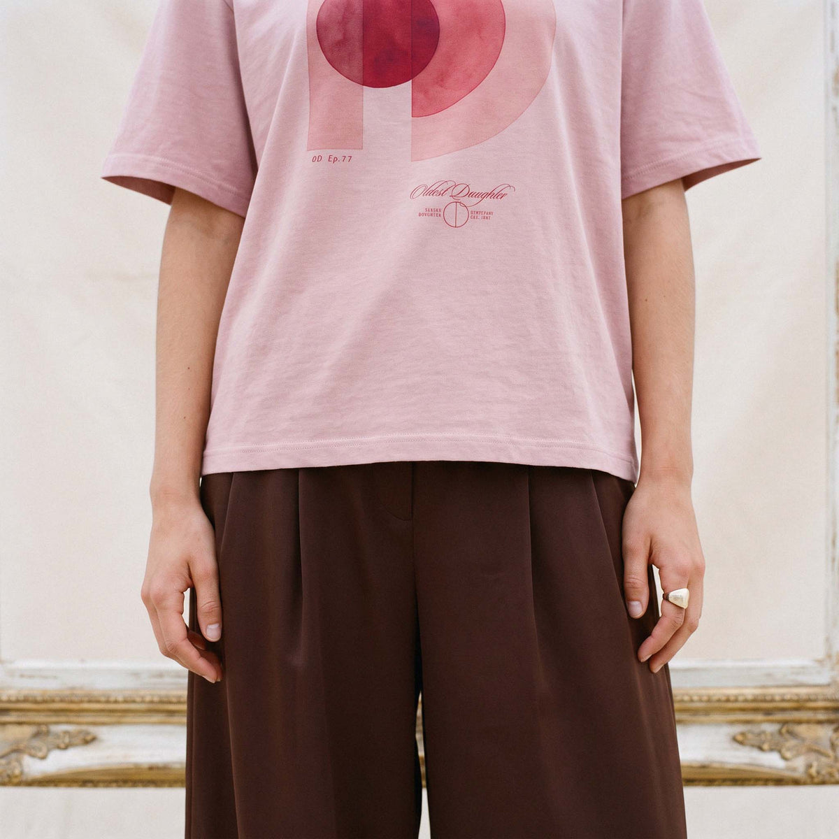 Close view of the AYLA tee front, showing the O and D print and the hem falling at the hip – Oldest Daughter