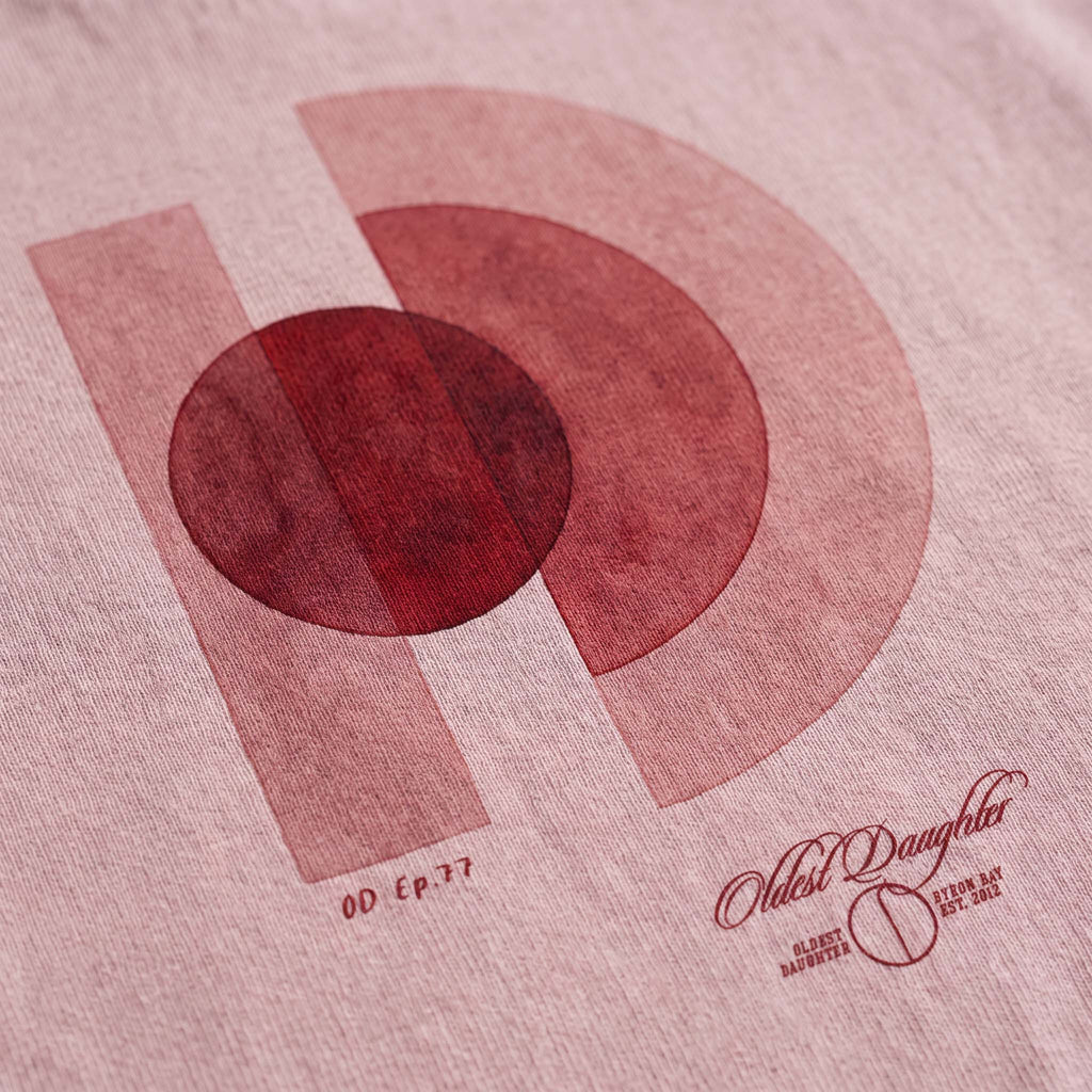The One World O and D artwork by founder Arki printed on blush garment-dyed organic cotton – Oldest Daughter