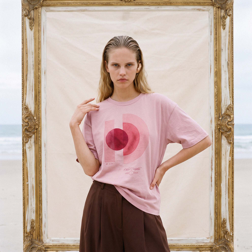 Three-quarter view of the relaxed boxy fit of the AYLA organic cotton tee in vintage blush – Oldest Daughter