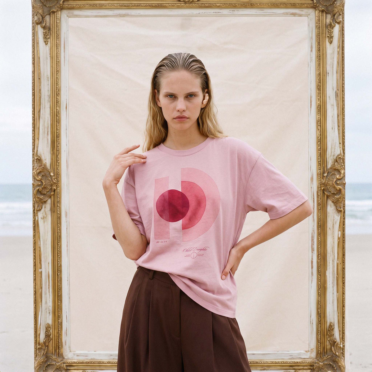 Three-quarter view of the relaxed boxy fit of the AYLA organic cotton tee in vintage blush – Oldest Daughter