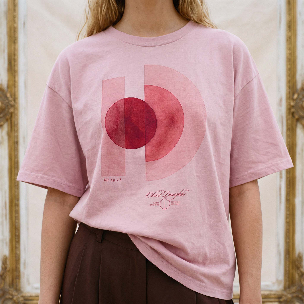 Front of the AYLA tee with the full One World print legible across the chest – Oldest Daughter, Byron Bay
