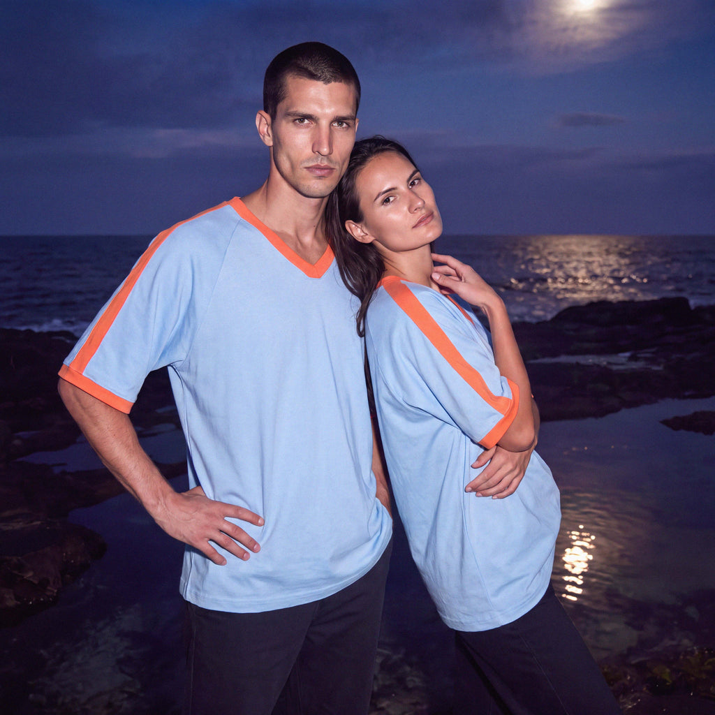 Half-length view of the sky blue BODHI organic cotton V-neck tee – Oldest Daughter