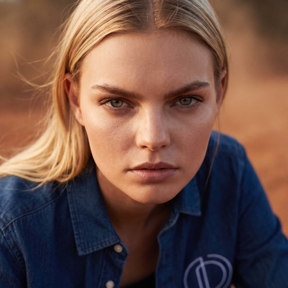 Full-length shot of the DEE organic denim shirt styled all in black – Oldest Daughter, Byron Bay