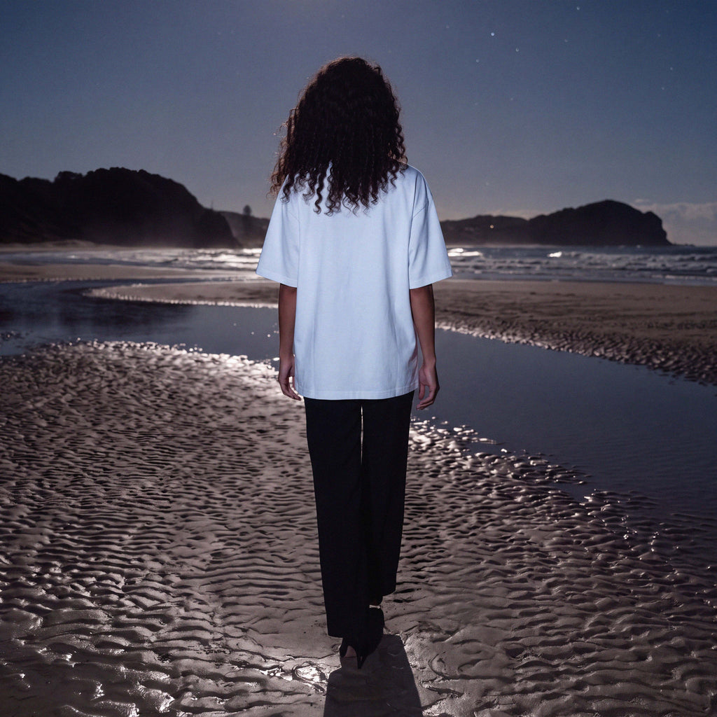 Full-length shot of a model in the CIARA white organic cotton oversized tee – Oldest Daughter