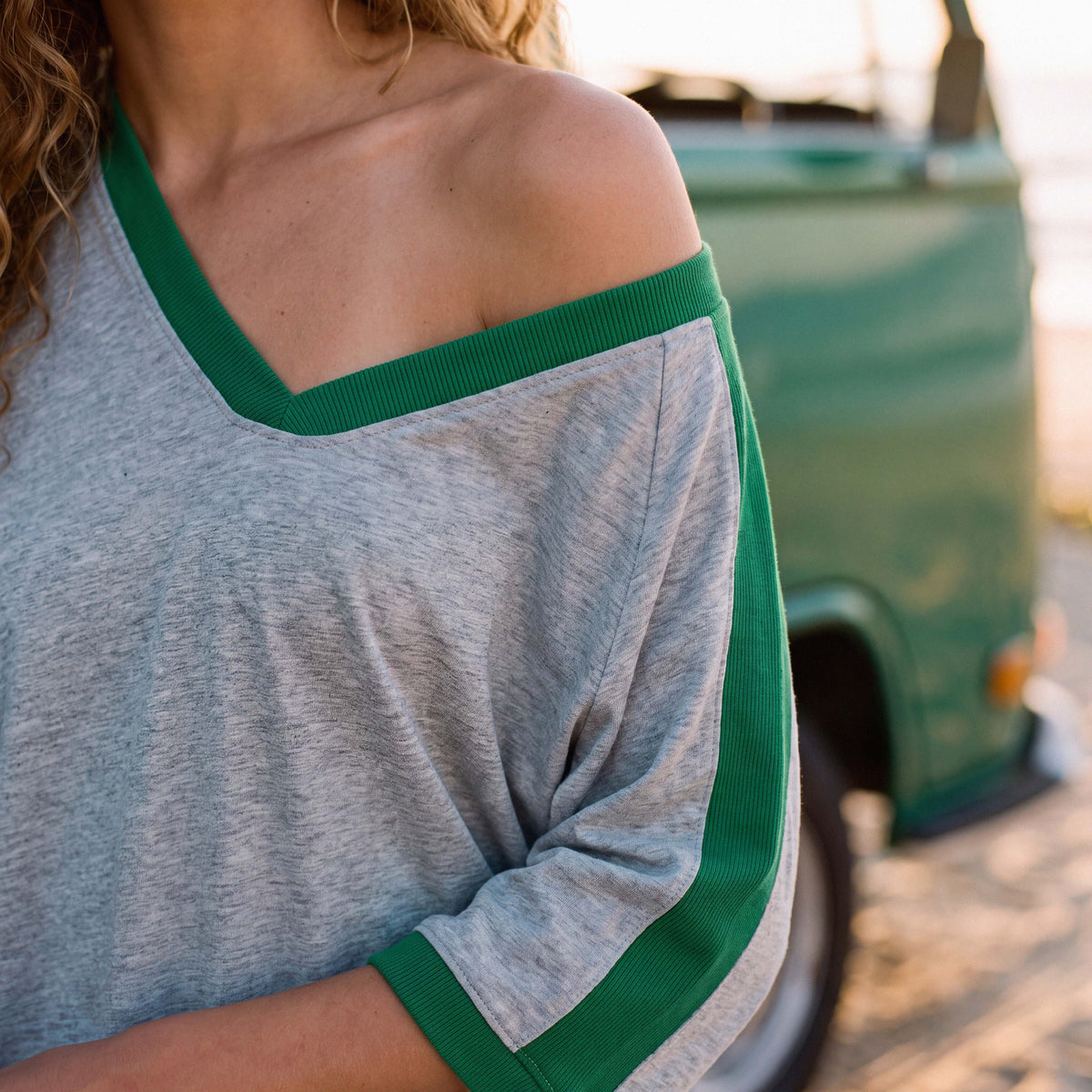 Side view of the extra-oversized FLO organic cotton tee in grey marle – Oldest Daughter