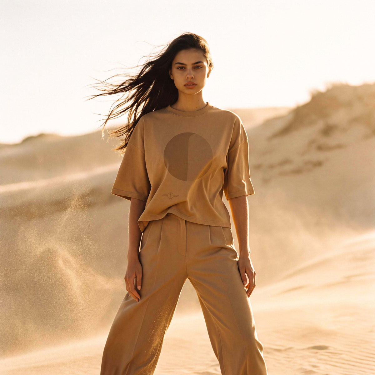 Model wearing the SANDI oversized boxy tee in sand recycled and organic cotton – Oldest Daughter, Byron Bay
