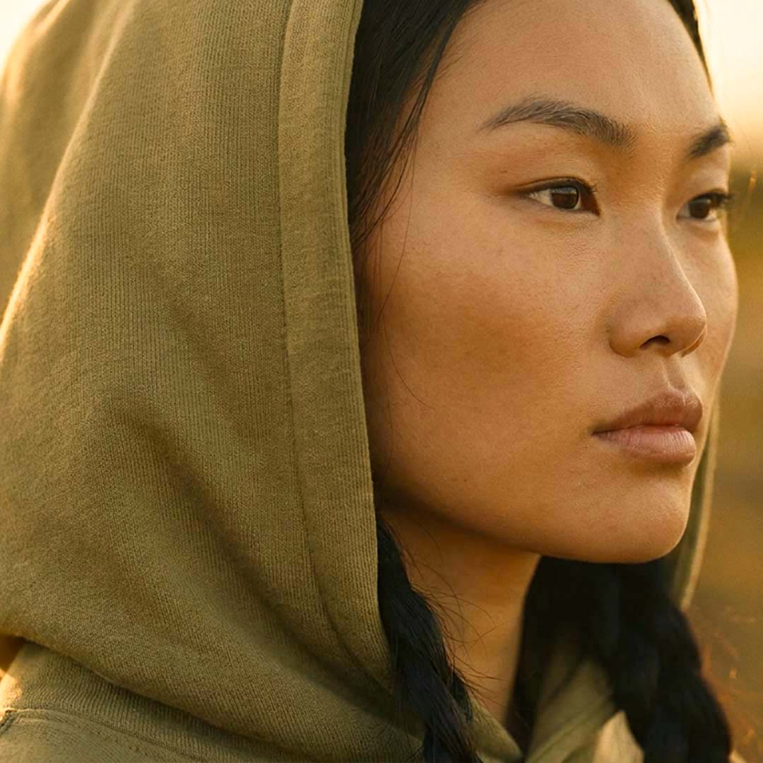Hood and drawcord detail on the faded olive YARA organic cotton hoodie – Oldest Daughter